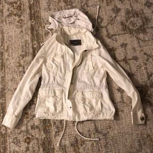 White Eddie Bauer breaker, hood fits in to collar